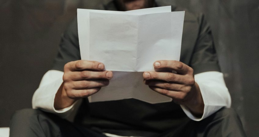 Defense attorney consulting with client about false rape allegations