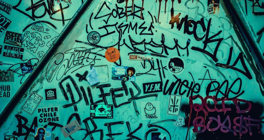 Dynamic graffiti art on an urban wall in Tokyo, Japan, showcasing street creativity.